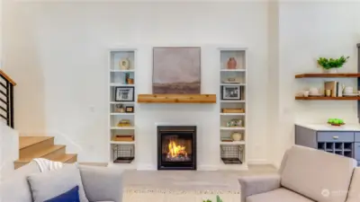 Cozy fireplace with built-ins and beautiful mantel set the perfect ambiance.
