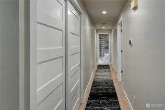 Large pantry at the beginning of the hallway
