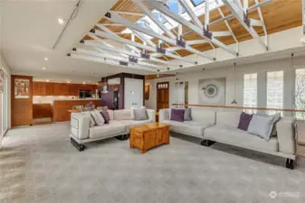 Architecturally, this home boasts a stunning vaulted ceiling made entirely of glass, offering the perfect opportunity to gaze at the stars from the comfort of your own space.