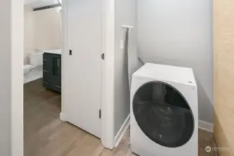 In unit washer/dryer combo plus large closet area.