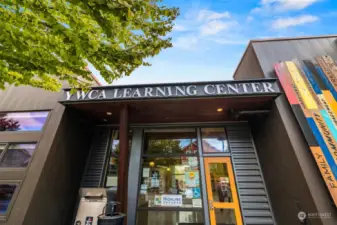 The neighborhood also features an Educare Early Learning and Head Start Center, a YWCA Adult Learning Center, and a King County branch library.