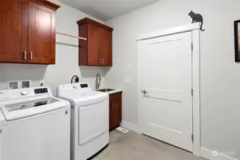 Laundry room leads to 3 car garage, includes large storage/coat closet.