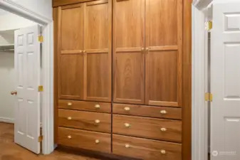 Primary Suite features dual large walk-in closets with California Closet system, plus additional custom drawer cabinets.