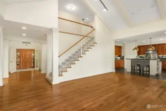 Beautiful hardwood floors and brand-new runner carpeting (2024) on the stairs.