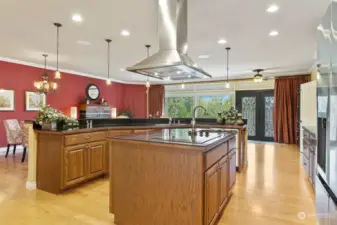What a kitchen! Large island with prep sink &overhead fan & lighting.