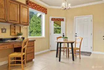 Large area off kitchen for formal dining or as a breakfast nook for your morning coffee. Built in desk, also an oversized pantry & broom closet aross from desk.