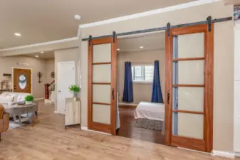 Main floor bedroom with French barn style doors