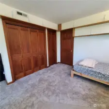 Upstairs bedroom and big closets with door to bathroom.