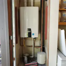 New tankless water heater located in garage.