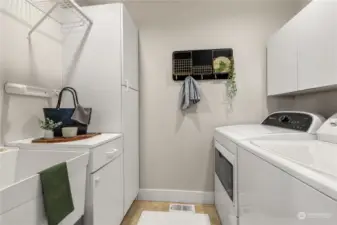 Laundry with cupboards than can be used for pantry space as well