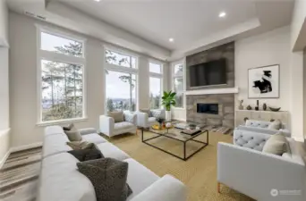 Living room features vaulted ceilings, gorgeous views, gas fireplace, & is wired for TV over mantle. *virtually staged