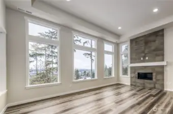 Gorgeous wall of windows and vaulted ceilings to enjoy lots of light and your incredible unobstructed view!