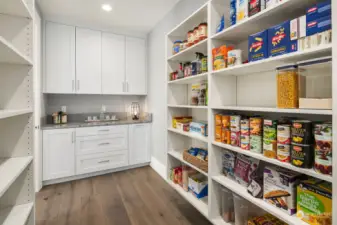 Pantry designed for hosting with abundant shelving space and counter prep area