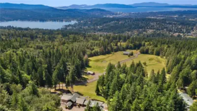 With over $5 million in Timber (permits in hand) on property, 52+ lots, 2 Full custom view homes, Guest Cottage, 2 barns, Pasture Land, riding & ATV trails, miles of roadway & infrastructure in place, double gates to enter the compound. Walk for hours without leaving your property. Endless Privacy & security.
