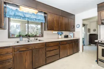 Large kitchen with plenty of storage and counter top area. Cabinets have 2 lazy susans and pull out shelves in the lower cabinets.