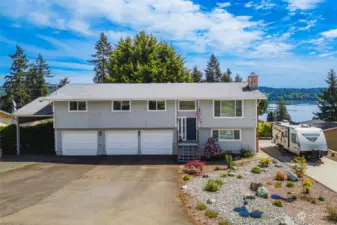A spacious 2052 sq ft home! 3 beds, 2+ baths, with views of the Sound & Rainier. Large RV pad w/30 amp hookup, 3 bay garage with work area & carport for extra parking/storage.