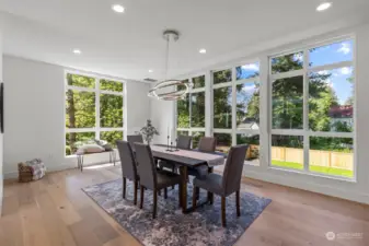 Light filled dining room looks out to the large yard
