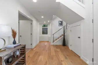 Downstairs hallway leads to a rec room, bedroom and full bath
