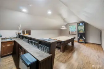 The loft features a fully plumbed bar and party room