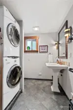 There is a half bath with a stacking laundry appliance set and even room for a closet at one side.