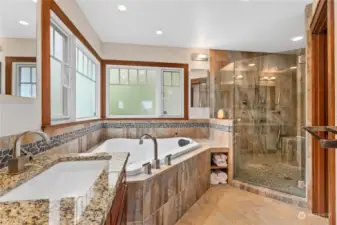The primary bath has a large soaking tub, huge walk in shower dual basin counter and radiant floor heating.