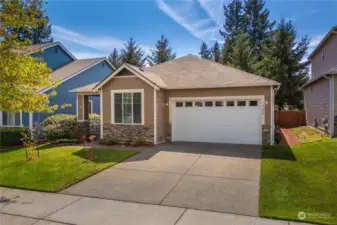 This charming abode features stunning landscaping, complete with a 2-car garage and a spacious driveway, ensuring additional parking space for you and your guests.