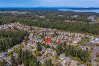 This home is perfectly nestled between the majestic peaks of Mt. Rainier and the Olympics, with the soothing waters of the Puget Sound nearby, offering a tranquil atmosphere.