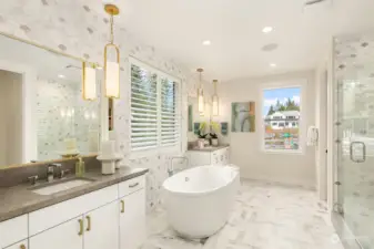 Truly spa-inspired primary bath with free standing tub, floor to ceiling marble tile mosaic