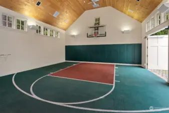 Two Story heated garage/basketball court with large mezzanine storage area. Schematic designs available for a second story ADU. No interior posts make it ideal for adding car lifts to accommodate up to 6 cars.