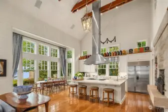 Unbelievably impressive commercial grade range hood highlights this chef's kitchen which features a 6-burner Wolf stove w/ built in grill, 2 dishwashers & subzero refrigerator. Not seen is a large walk-in pantry boasting double Wolf ovens and another subzero refrigerator.