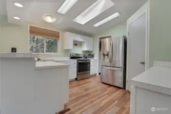 Lots of light in this home and storage!  All appliances stay. Pantry is next to the fridge.