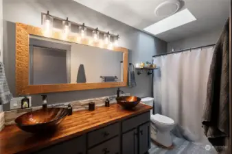 The attached ensuite bathroom adds a touch of elegance and privacy, completing this serene and stylish sanctuary.