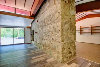 Fireplace/boiler stone & concrete divider between great room and family room