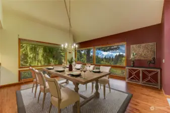 Formal size dining room with built-in shelves and tranquil views.