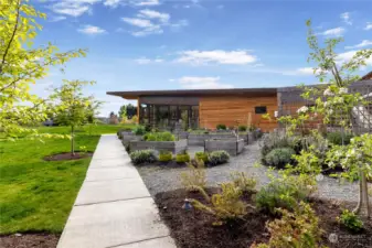 Shared gardens and green spaces unite neighbors with the natural surroundings, while the community center offers a space for social gatherings and events.