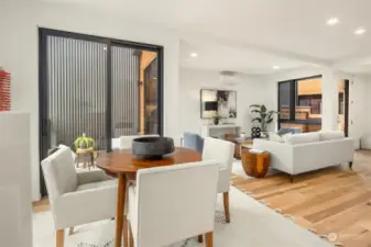 The dining room offers wonderful access to the front patio with a large sliding glass door, seamlessly blending indoor and outdoor living and creating an inviting space for al fresco dining and entertaining.