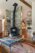 Centrally located Blaze King woodstove distributes heat nicely throughout home.