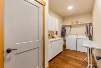 Spacious laundry room. Mechanical room on left includes furnace and 2nd hot water tank.