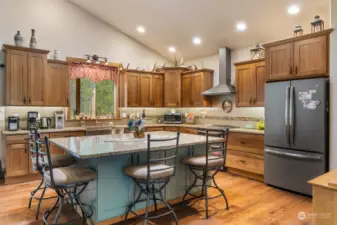 Kitchen features tons of cabinets including large drawers for convenient storage.