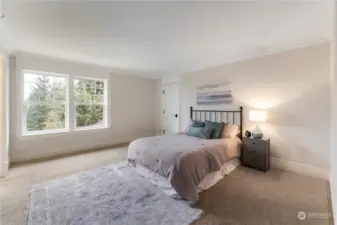 Bdrm #2 is large with a custom walk-in closet with shelves and drawers, crown molding with access to the jack and jill bathroom.
