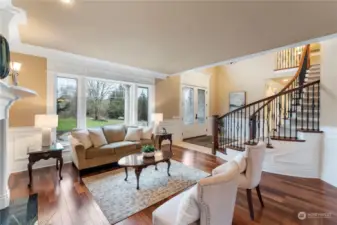 Hardwood floors, triple crown moulding and a gas fireplace