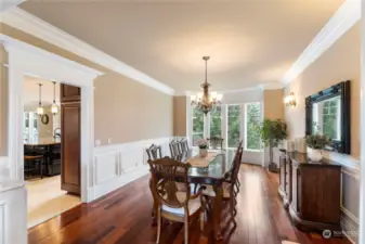 Spacious dining room has 2 built-in cabinets which aren't shown. Dining room overlooks the back yard and has a gorgeous view.