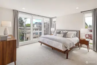 Located on the third floor is this sumptuous primary ensuite with floor to ceiling windows with custom blinds, soft as can be carpet and mini-split for ultimate comfort. Spacious enough for a king size bed, double dressers and so much more.