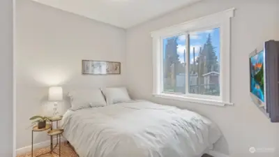 Bedroom #1 with tons of natural light and window overlooking the back yard.