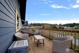 Private deck to enjoy the open field across the street and water views!