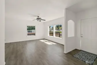 LVP flooring throughout, vaulted ceilings, and bright crisp paint