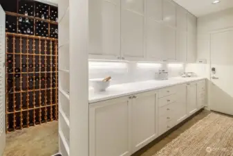 Dreamy pantry with so much storage.  Secret access leads you to 1300+ Wine bottle storage with 2021 SC Pro 300 in-wall WisperKOOL Pro Wine cooler.