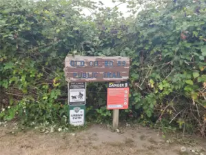 Old County Road 59 Trail Head Signage at the edge of the Liberty Bay Estates property. A great trail to walk or ride.  Discover the history of Poulsbo on your nature trail hikes!!