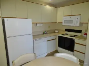 Kitchen/Dining Area w/ all appliances, utensils, dishes, etc.