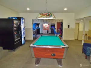 Game Room w/ pool table, vending, pin ball and other game machines.